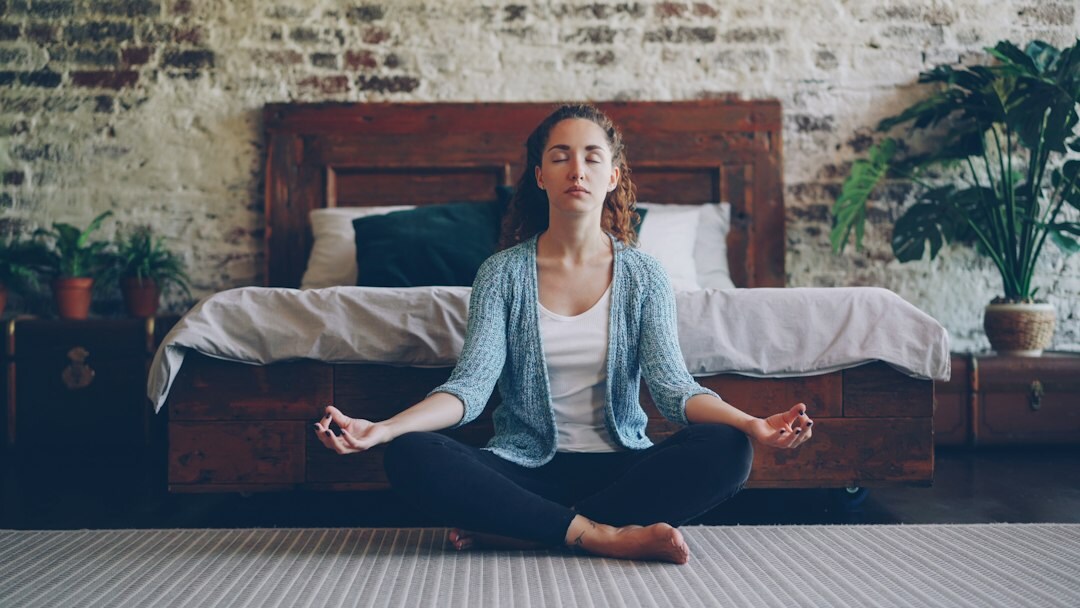 person meditating at home