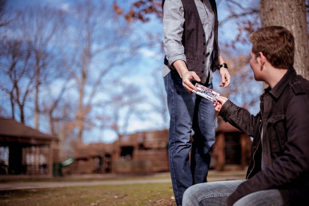 Two insurance professionals reviewing paperwork together at a desk