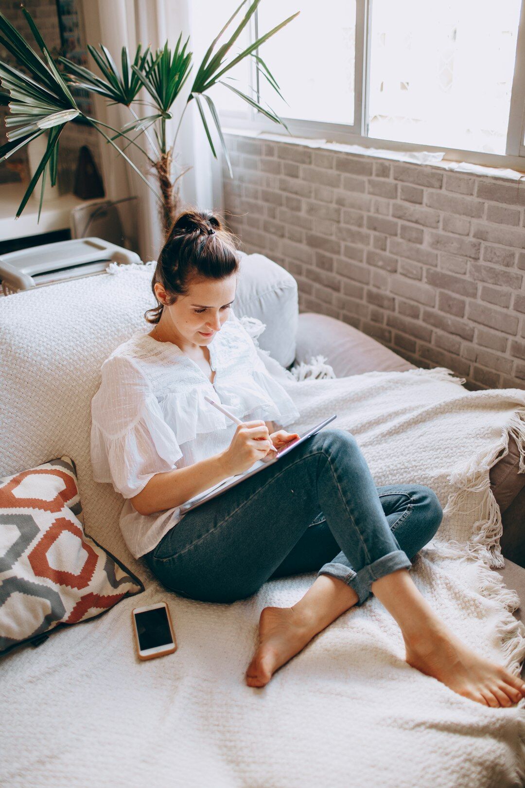 Woman reviewing her health insurance claim dashboard on a laptop at home